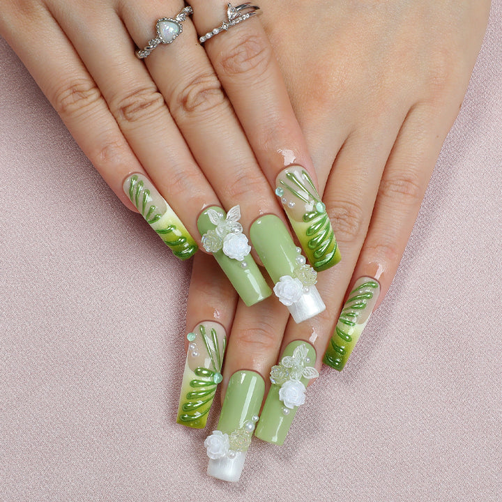 Creative nail set with floral design and delicate accents Kalsten