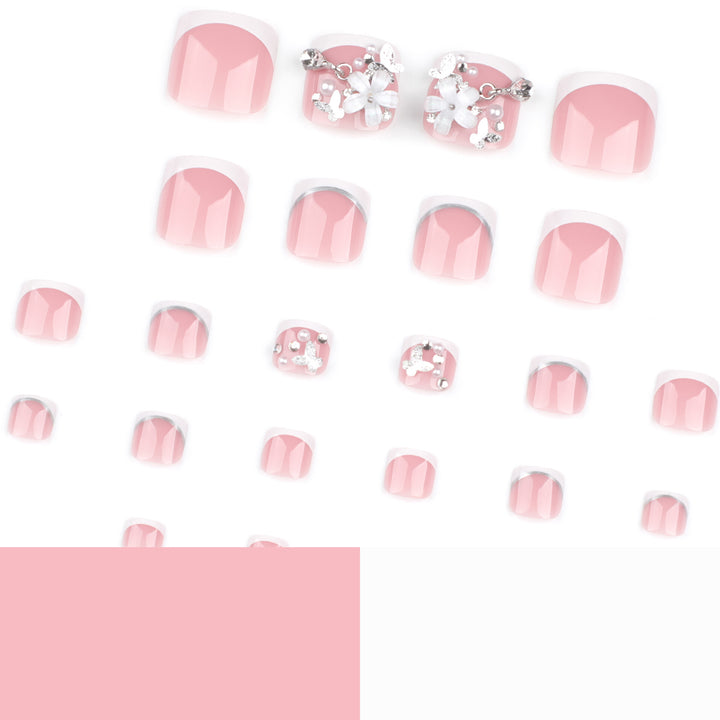 Artful toenail design with elegant flower and glitter accents Kalsten