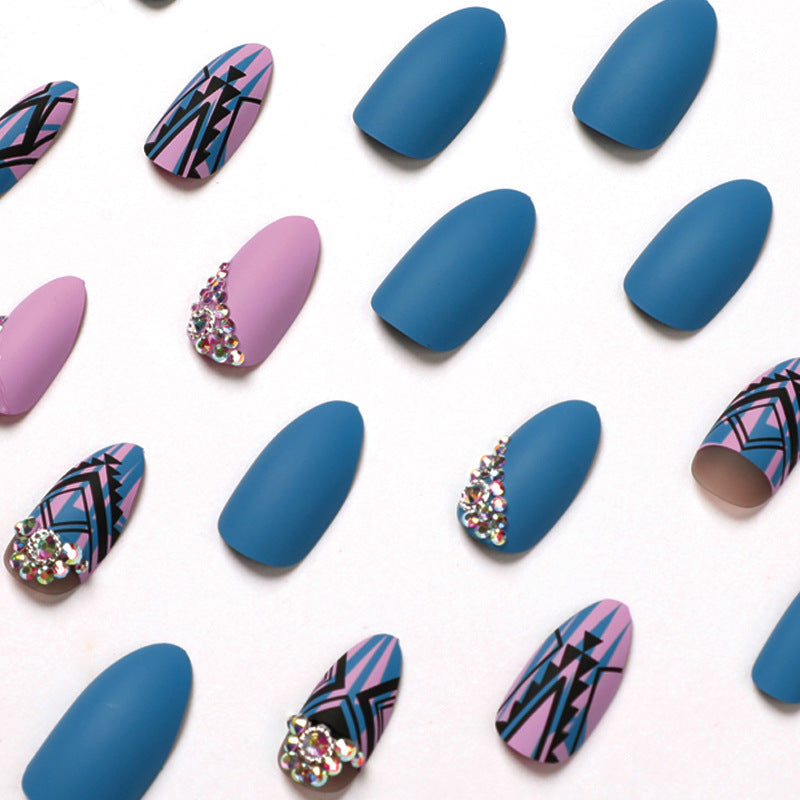 Artful stiletto nails with modern geometric designs and rhinestone embellishments Kalsten