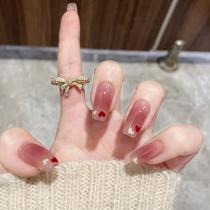 Artificial nails with heart accent and glamorous decorations Kalsten