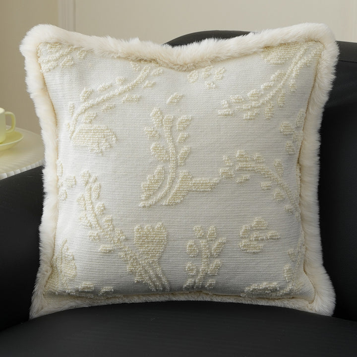 Square decorative pillow with embossed circular relief and soft faux fur edging