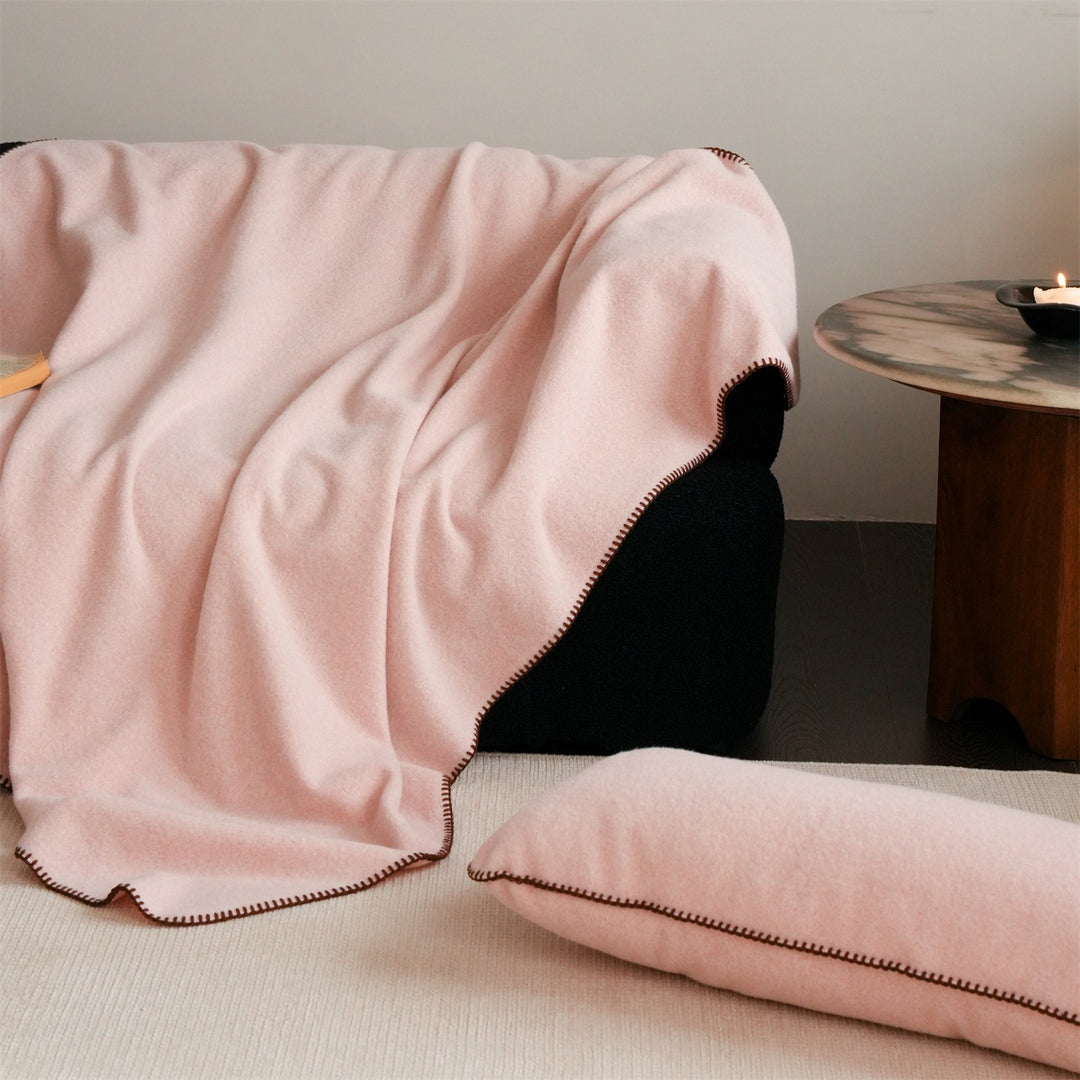 Premium wool blanket with fine hand-stitched edge and particularly soft drape