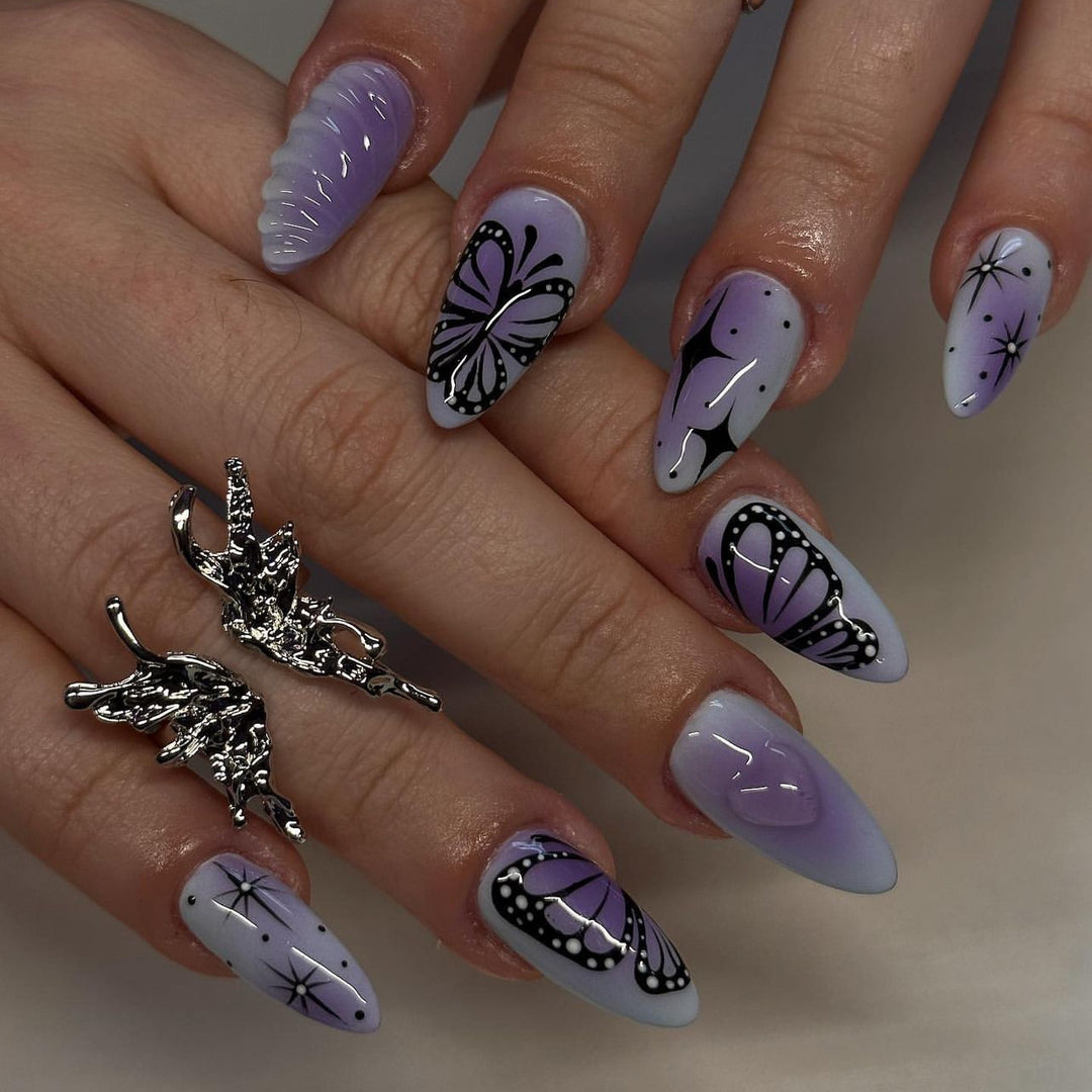 Artful stiletto nails with elegant butterfly design Kalsten