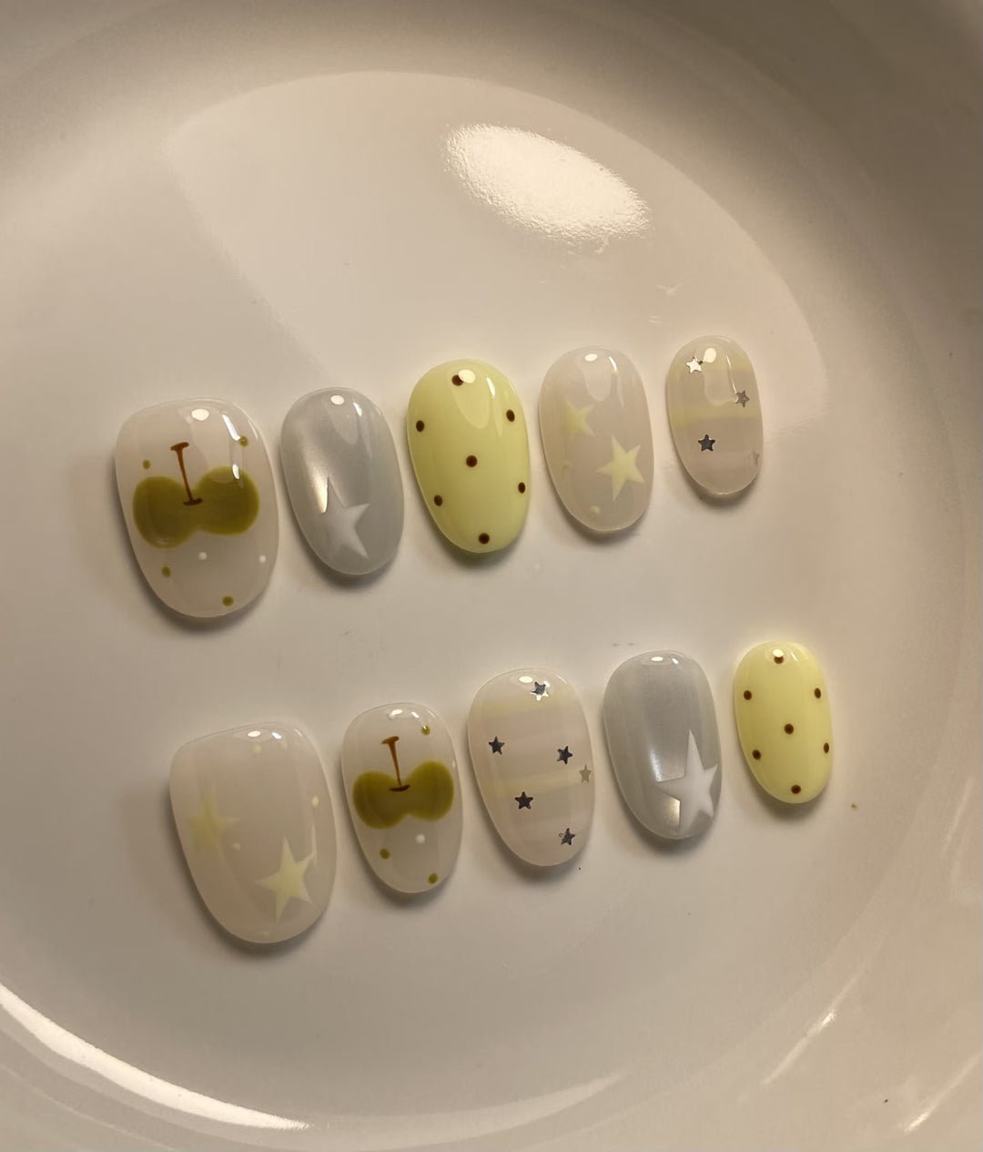 Artistic Press-On Nail Set with Whimsical Patterns