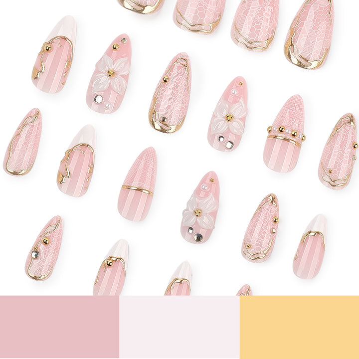 Artful nail extensions with delicate flower and gold embellishments Kalsten