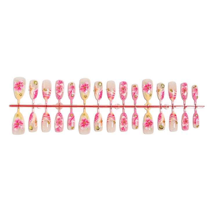 Artificial nails with floral embellishments and glitter accents Kalsten