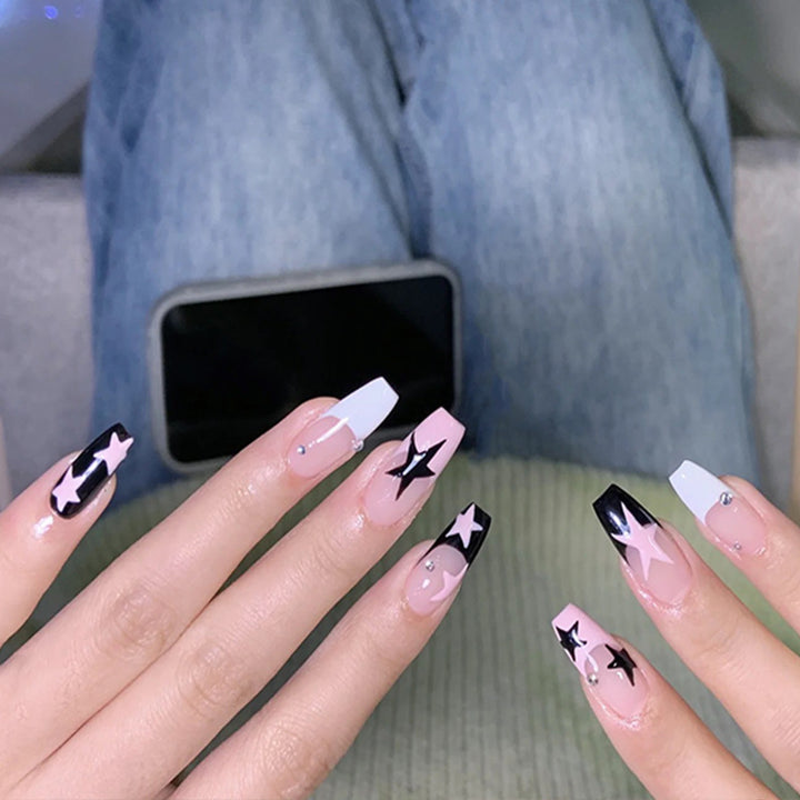 Artificial nail set with glamorous star design and sparkling accents Kalsten