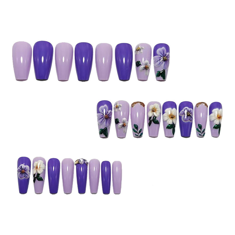 Artificial nails with floral embellishments and elegant high gloss Kalsten