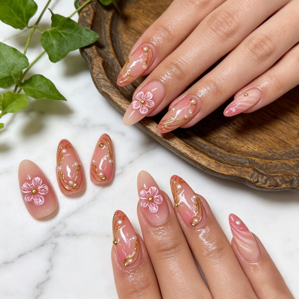 Artificial nails with floral decorations and gold accents Kalsten