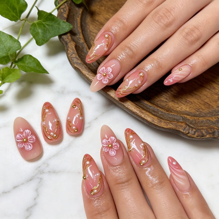 Artificial nails with floral decorations and gold accents Kalsten