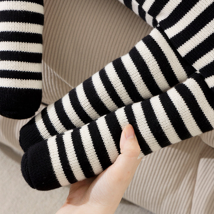 Striped decorative knitted cushion in animal shape with fringes and four-legged look Kalsten