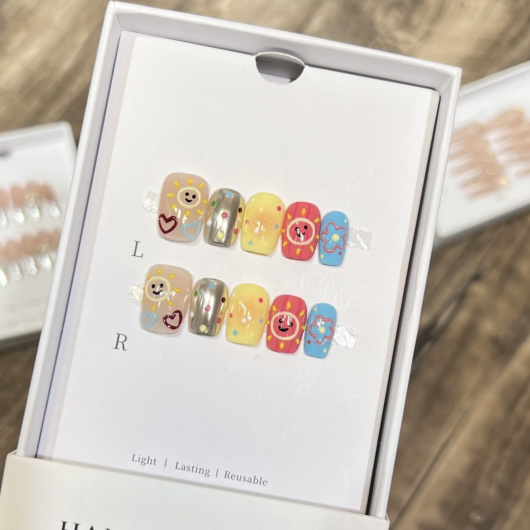 Whimsical Press-On Nail Art Set with Smiley Faces and Floral Designs Kalsten