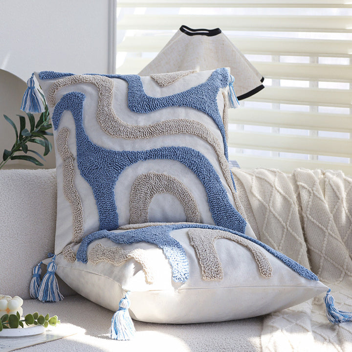 Square cushion cover with relief hand-tufted wave structure made of cotton-linen blend and decorative corner tassels Kalsten