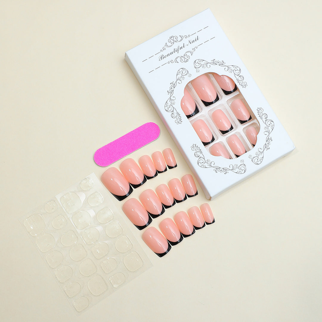 Artificial nail set with elegant French tip design and modern accents Kalsten