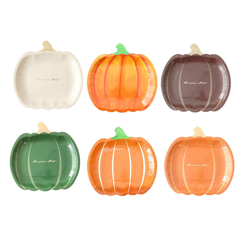 Disposable paper plates in pumpkin shape with spooky face design