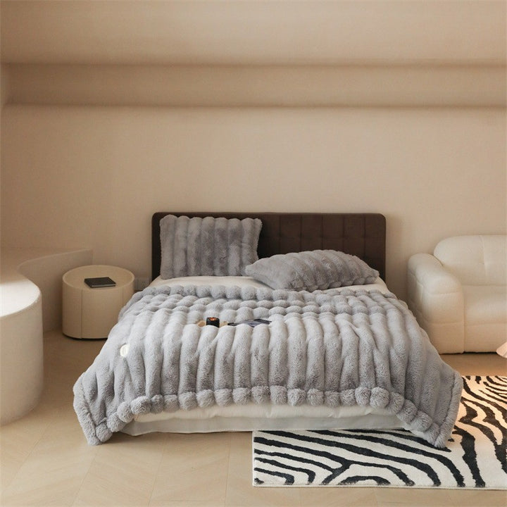 Faux fur blanket with ribbed structure design and velvety soft pile