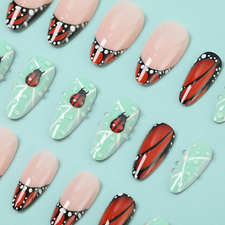 Creative nail art with elaborate butterfly and flower designs Kalsten