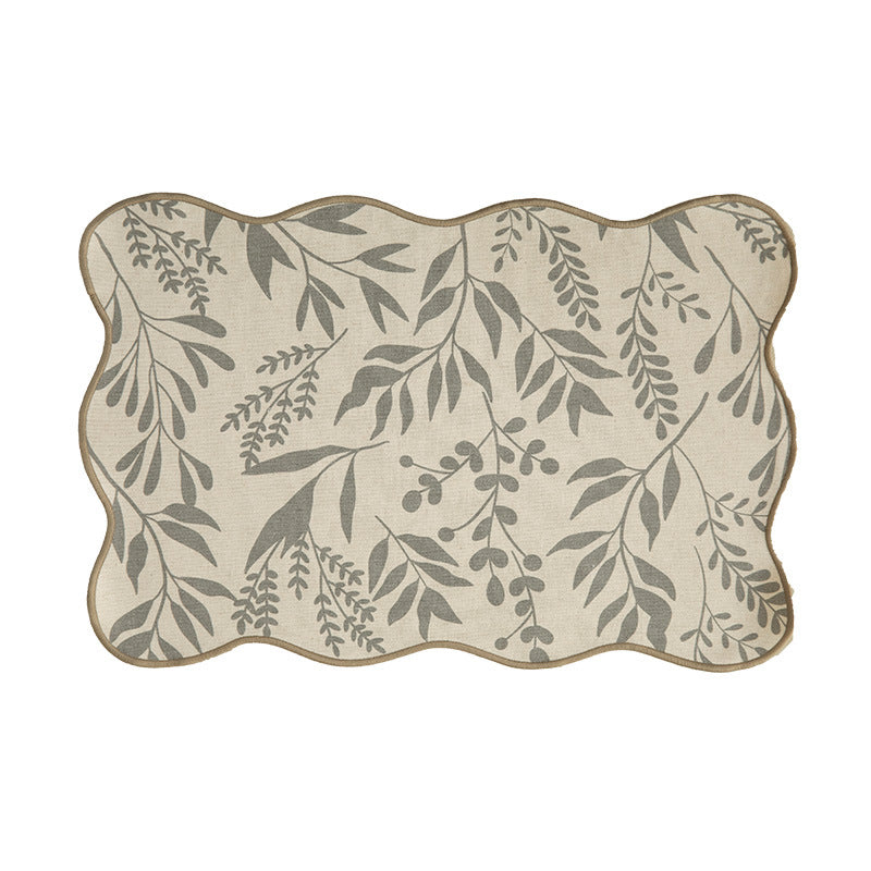 Shaped table set with curved contour and botanical leaf pattern Kalsten