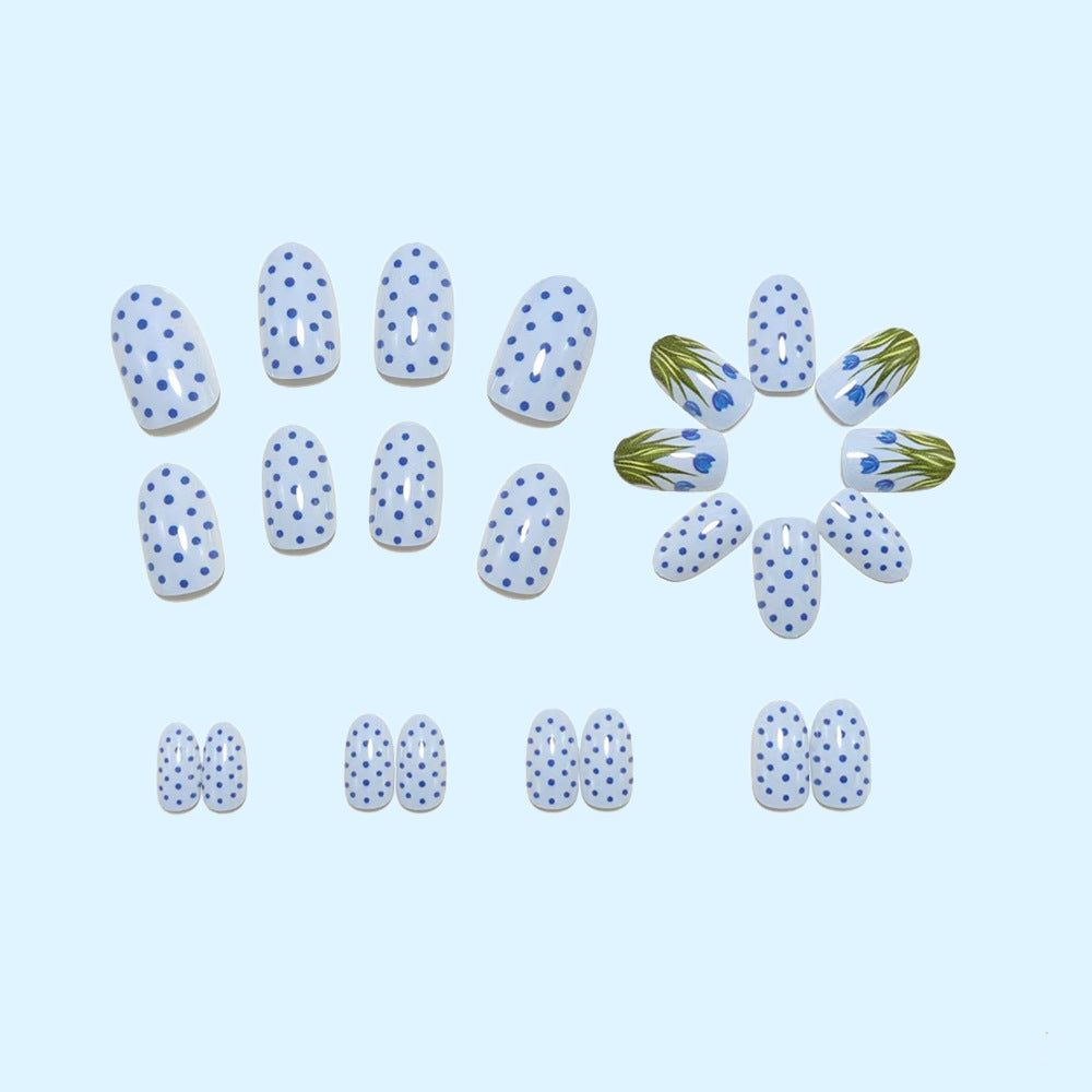 Creative art nails in an elegant polka dot design with floral accents Kalsten