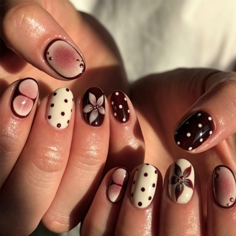 Acrylic nail set with floral accents and elegant design Kalsten