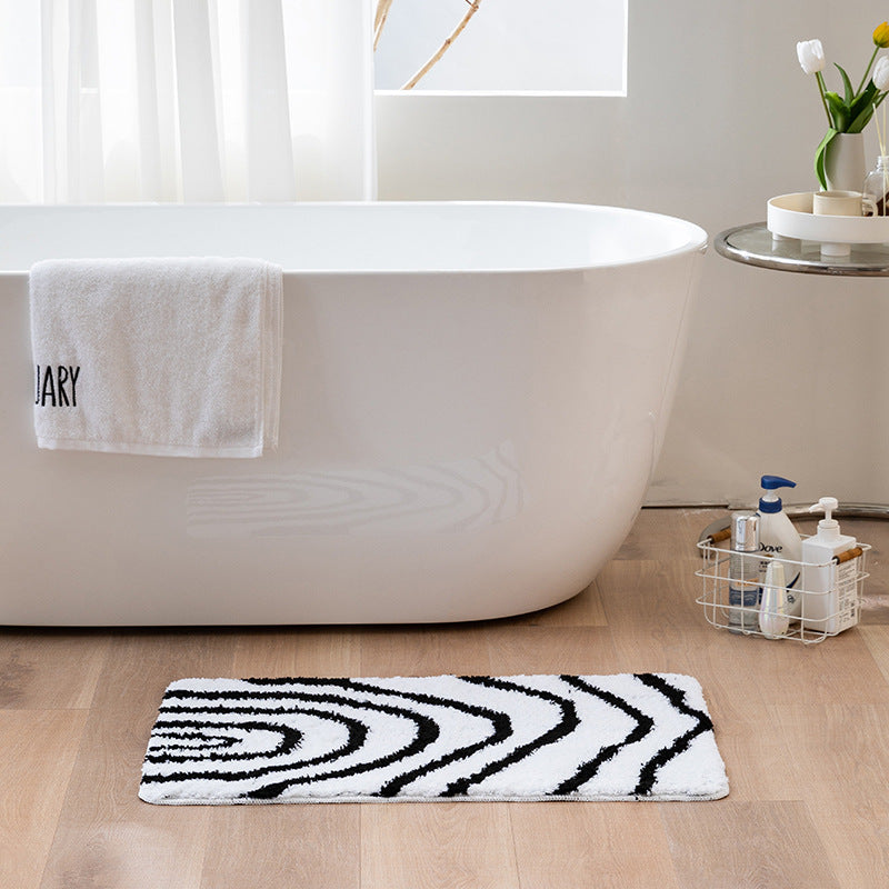 Fluffy bath mat in a graphic wave relief with anti-slip base Kalsten