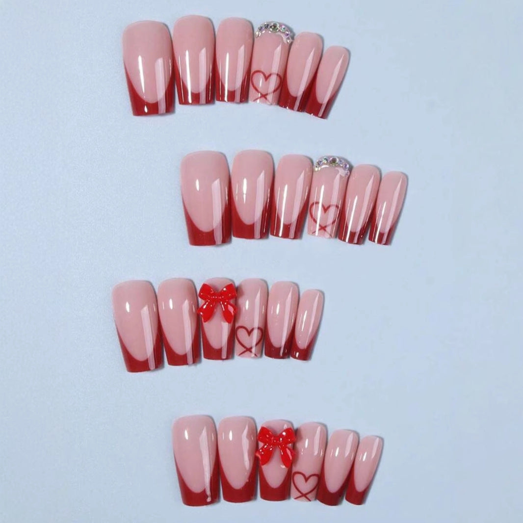 Nail art with heart and bow motifs Kalsten