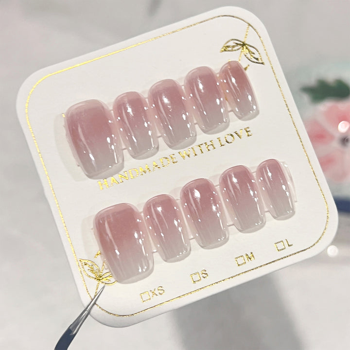 Artificial nail extensions in elegant ombre design Kalsten