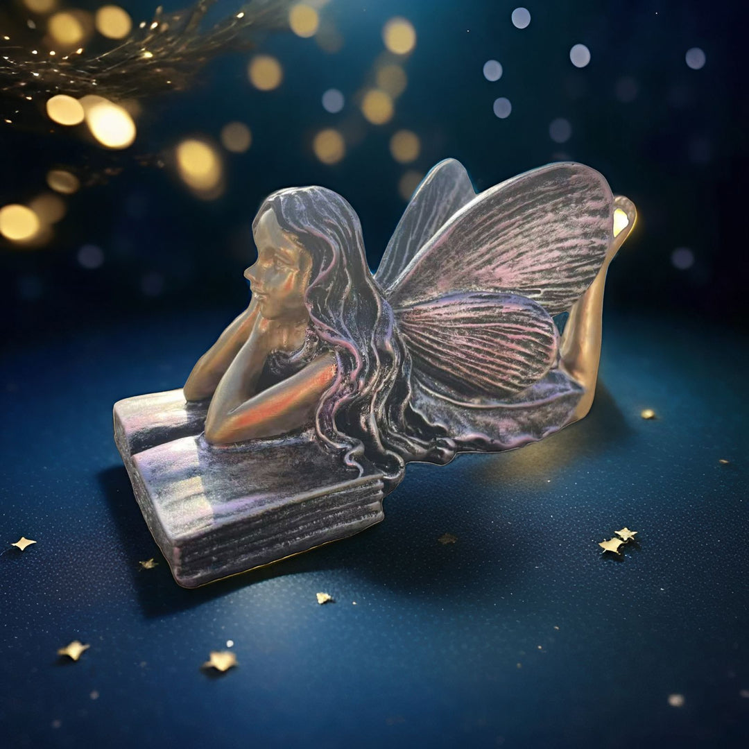 Fairy Figurine Sitting on Books Kalsten
