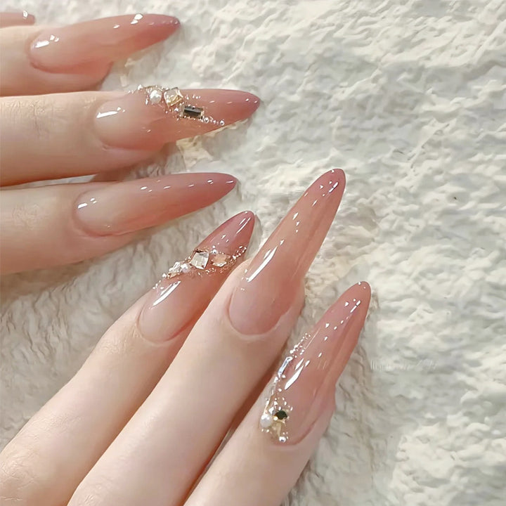Artificial nail set with elegant ombre effect and glamorous embellishments Kalsten
