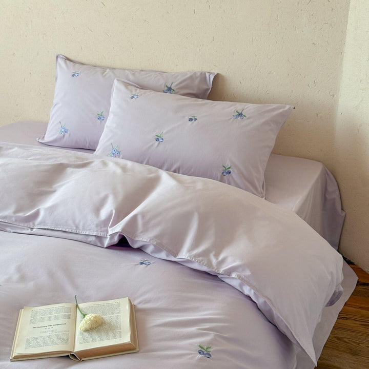 Luxurious cotton satin bedding set with delicate berry embroidery and silky-matte finish