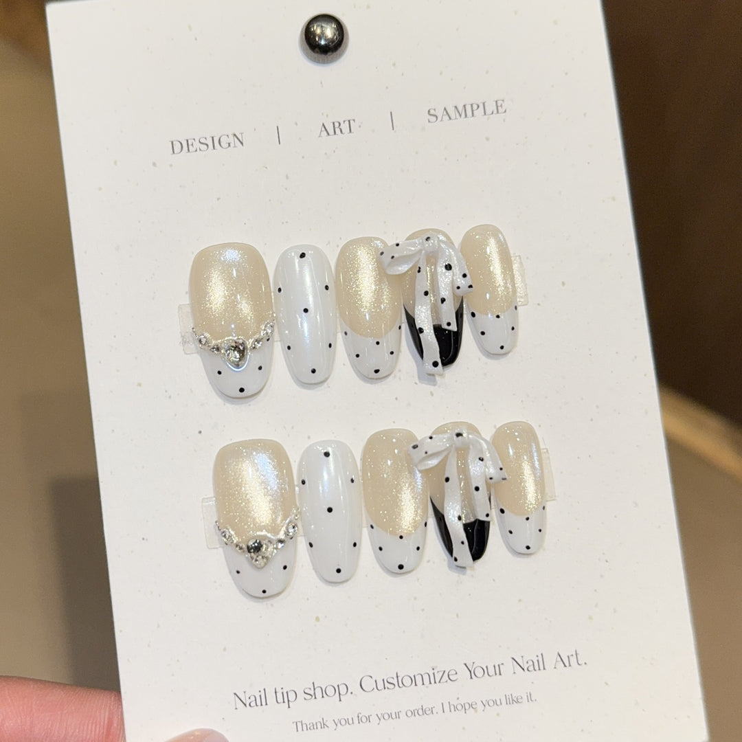 Artificial nails with glitter and bows Kalsten