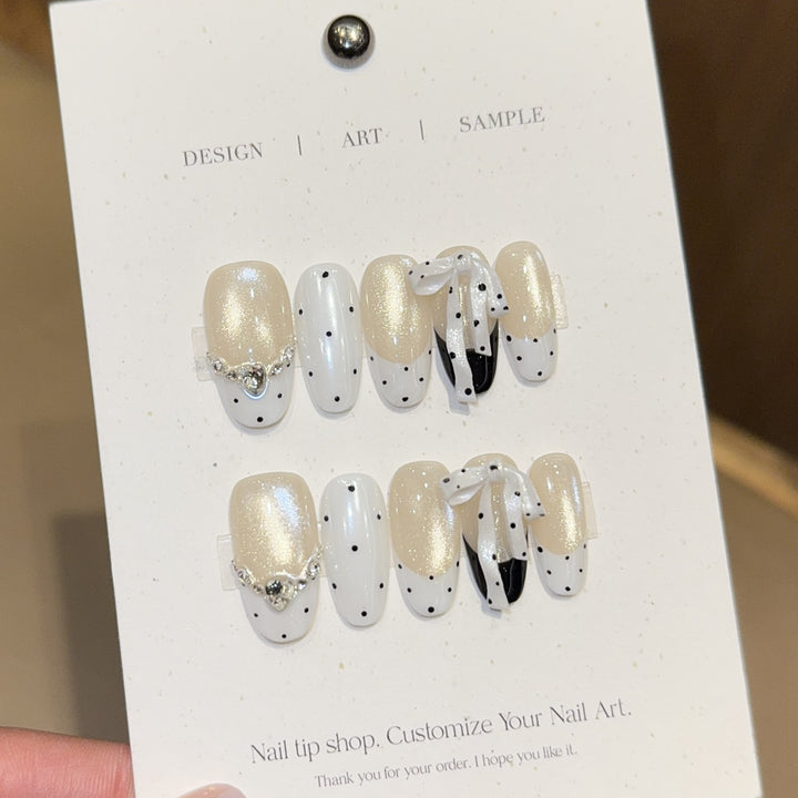 Artificial nails with glitter and bows Kalsten