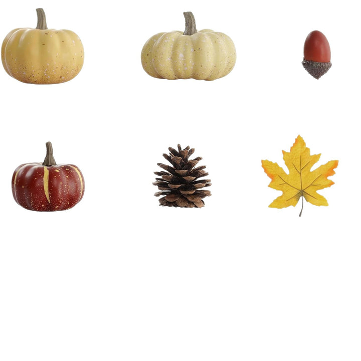 Autumn decorative set made of realistic artificial pumpkins, pine cones, acorns, and maple leaves