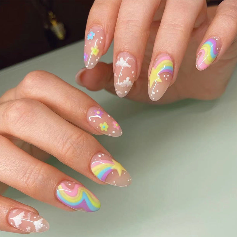 Artful nail art with cheerful designs and colorful accents Kalsten
