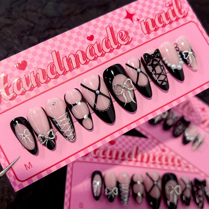 Artful nail art with elegant bows and glitter accents Kalsten