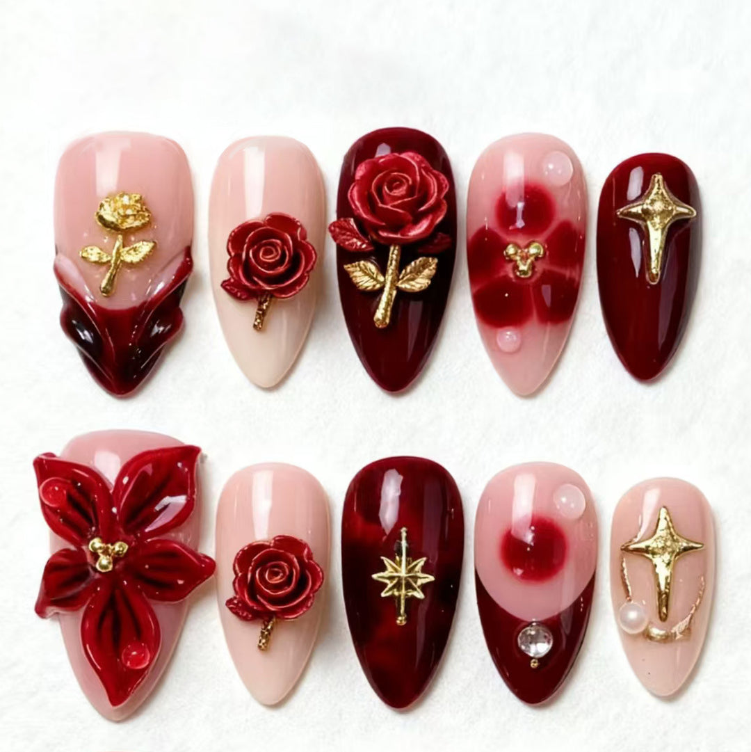 Artificial nail set with elegant floral applications and glamorous accents Kalsten