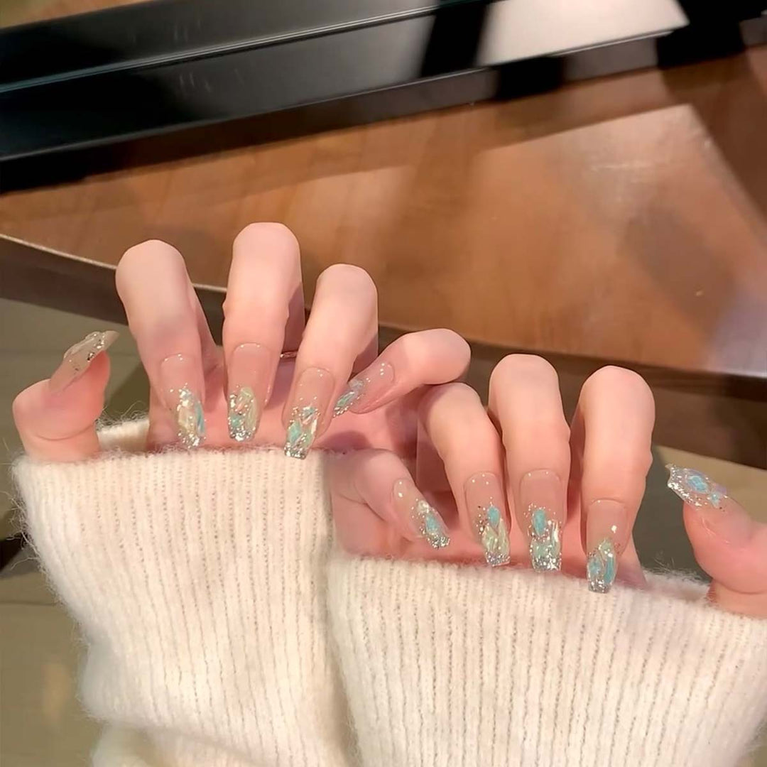 Glamorous nail tips with glitter accents Kalsten