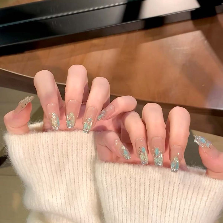 Glamorous nail tips with glitter accents Kalsten