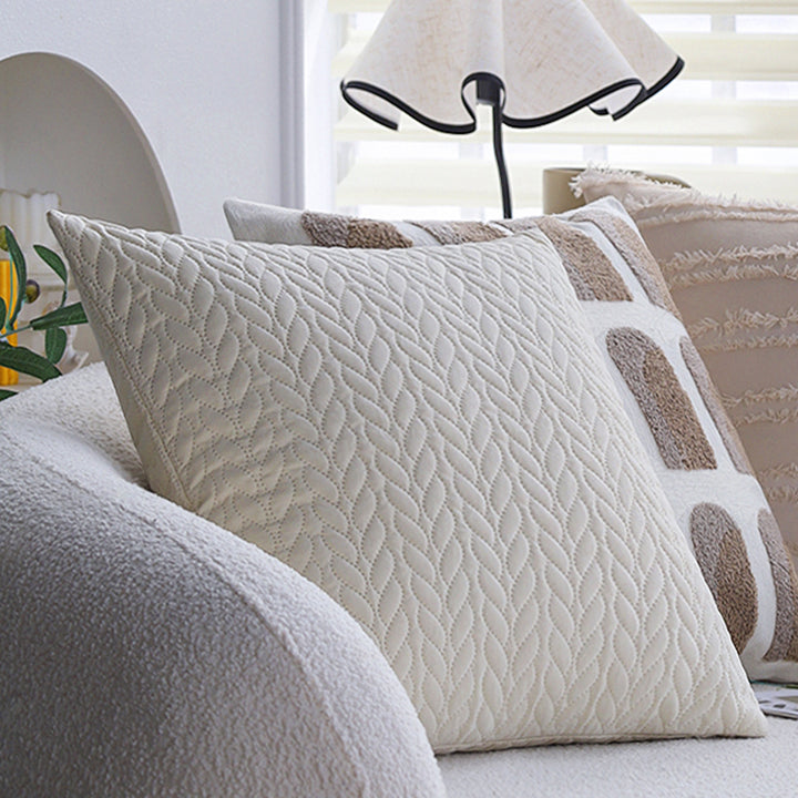 Decorative cushion cover with knotted grid structure and fine woven applications Kalsten