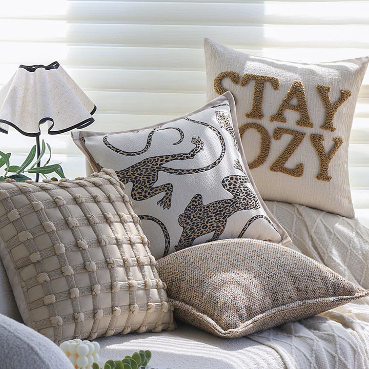 Square decorative cushion cover made of mottled bouclé weave with subtle piping Kalsten