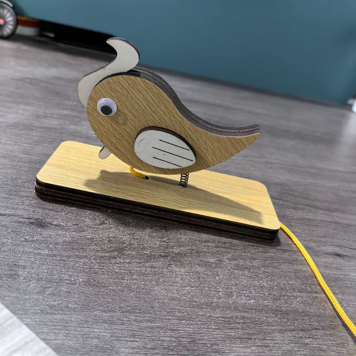 Unisex nan movable wooden bird table figure made of plywood with spiral spring and pull line Kalsten