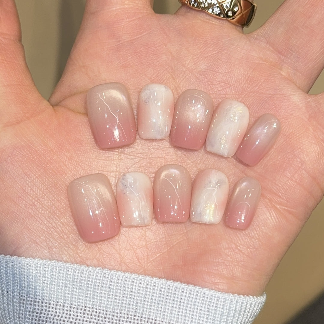 Artificial nails with elegant gradient colors and holographic accents Kalsten
