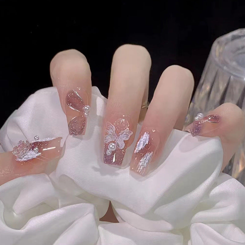 Glamorous artificial nails with delicate flower and glitter effects Kalsten
