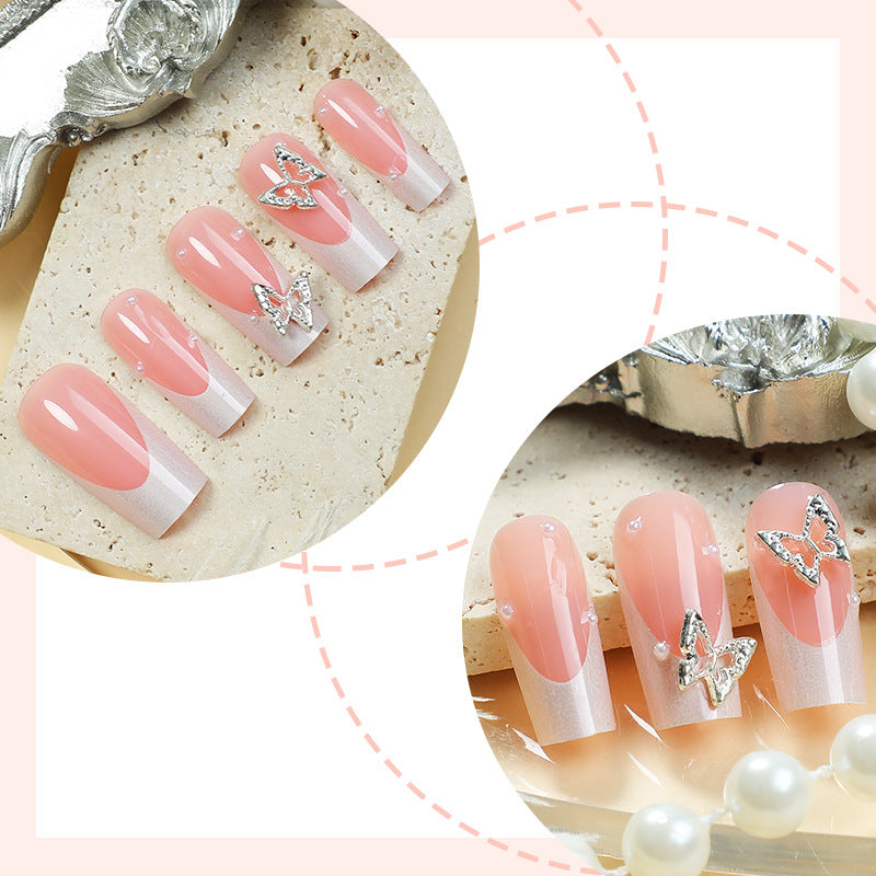 Nail art set with intricate designs and butterfly appliqués Kalsten