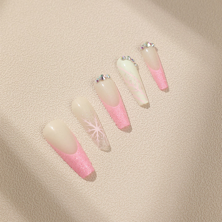 Artistic stiletto nails with glitter and snowflake design Kalsten