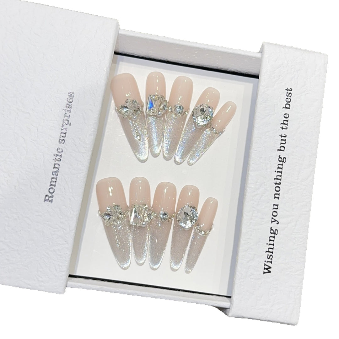 Glamorous artificial nails with sparkling rhinestone embellishments Kalsten