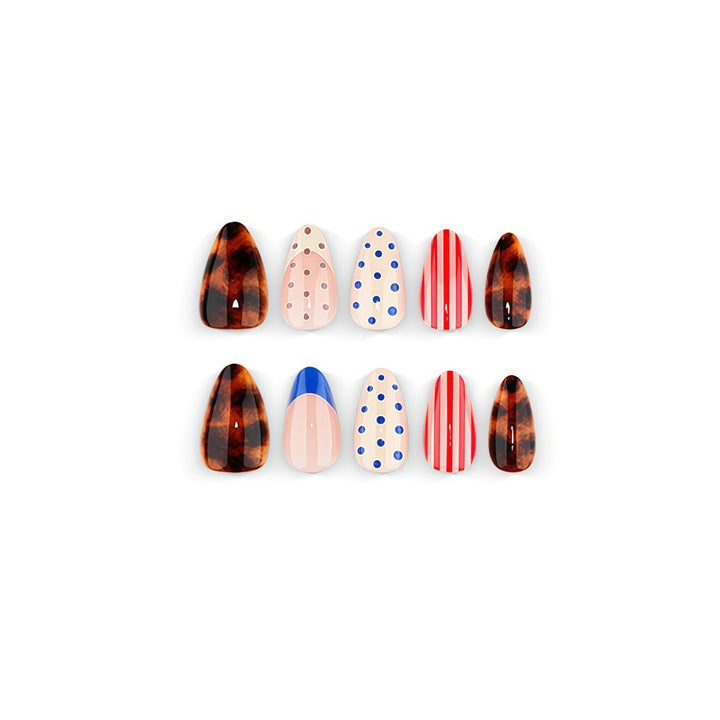 Fake nails in playful design with dots and stripes Kalsten