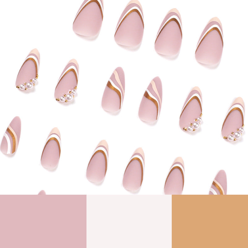 Artful stiletto nails with elegant gold and white accents Kalsten