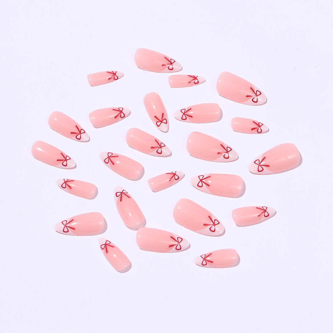Artificial nail set with playful bow design Kalsten