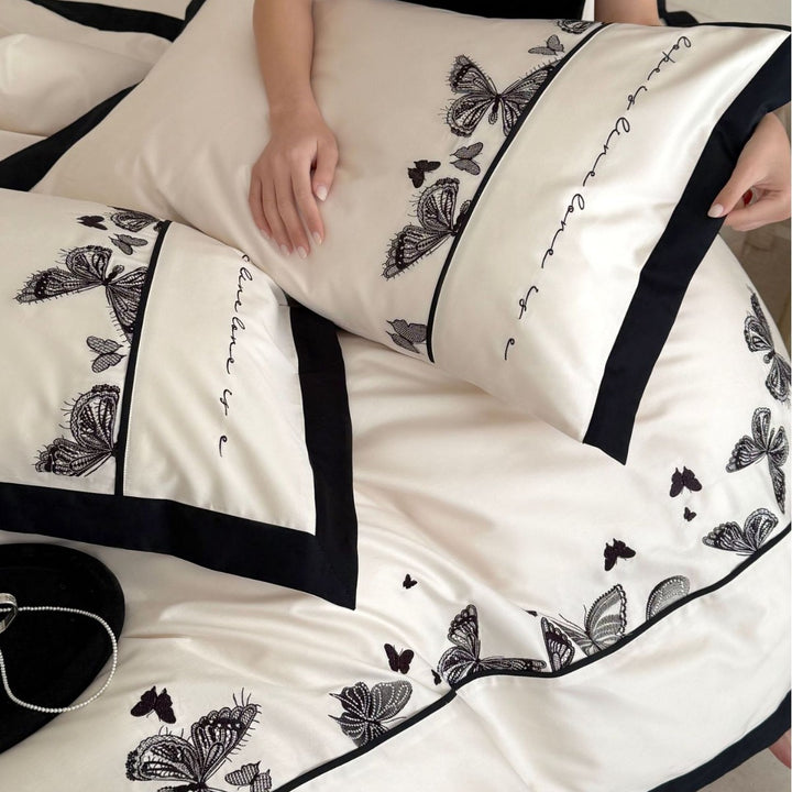Luxurious cotton satin bedding set with butterfly embroidery and contrasting piping Kalsten
